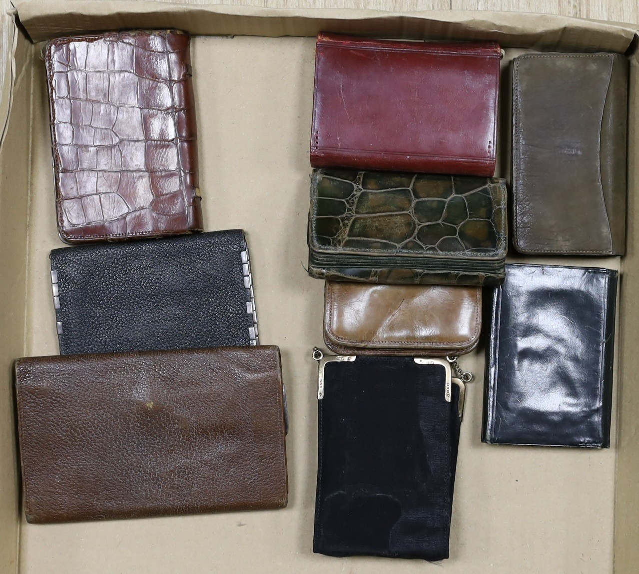 Two Art Nouveau silver mounted crocodile purses, various other silver mounted purses. (9)
